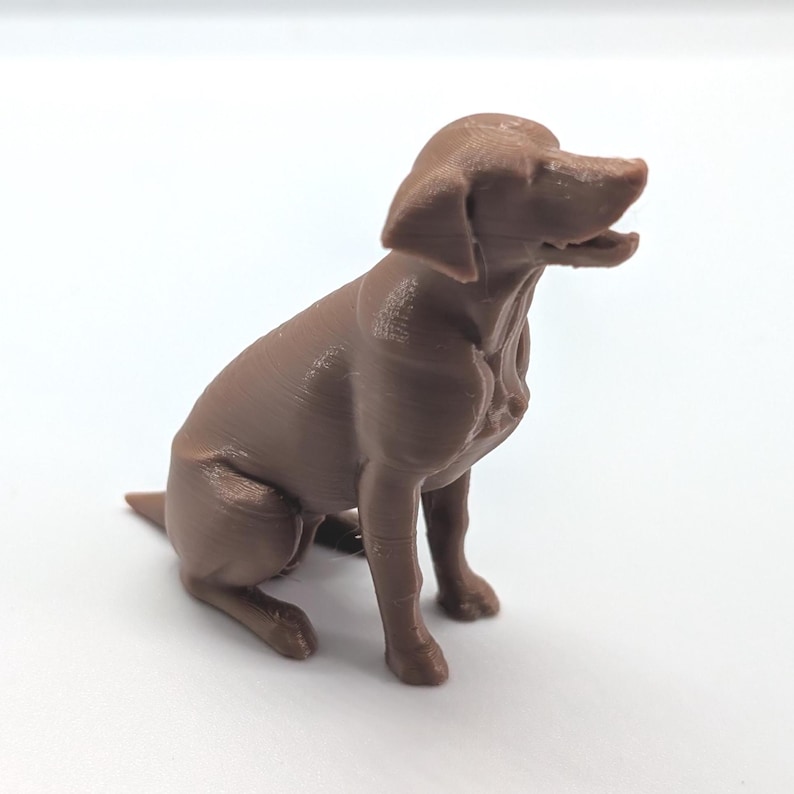 Brown  3D printed figurine of a Labrador Retriever dog sitting, white background, side view