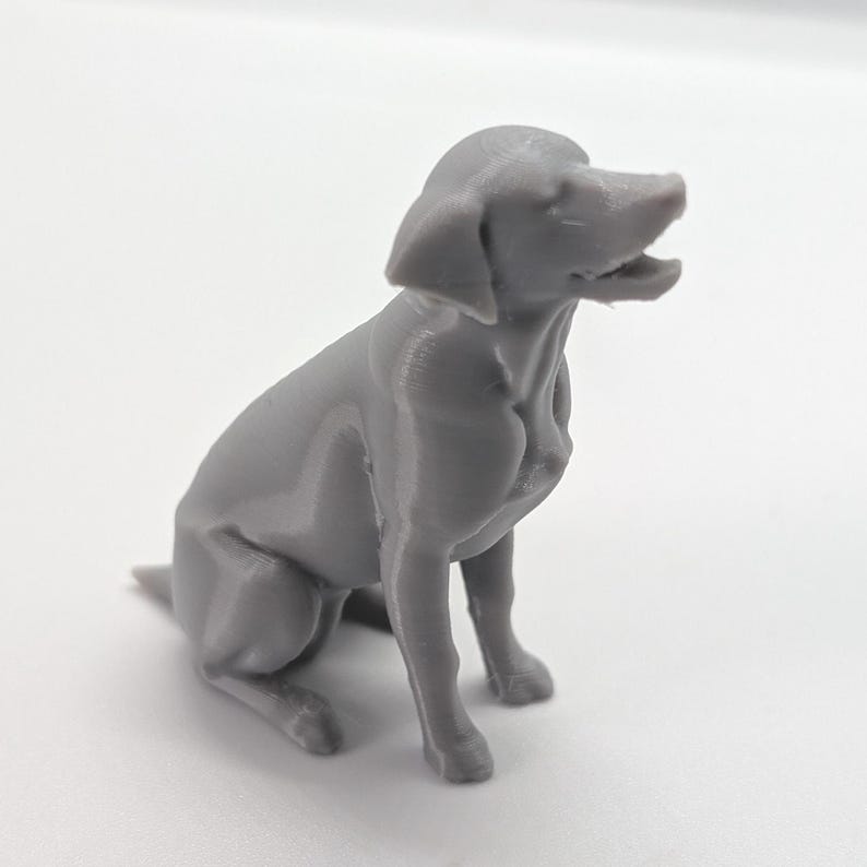 Grey  Labrador Retriever dog home decoration,  3D printed figurine on sitting position, white background, side view