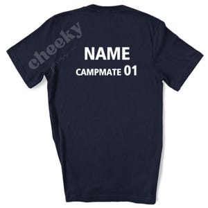 May include: Dark navy blue t-shirt featuring the white text "NAME CAMPMATE 01". The left shoulder displays "cheeky press co.". Ideal for camping or outdoor pursuits, this t-shirt is a comfortable and stylish choice.