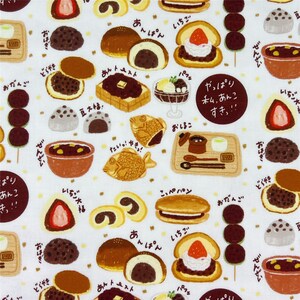 May include: A white fabric featuring a repeating pattern of various Japanese red bean sweets including taiyaki, dango, dorayaki, and strawberry daifuku, accompanied by Japanese text labels and brown circular text bubbles with the phrase やっぱり私、あんこすき!!