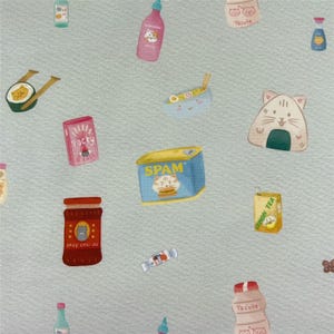 May include: A light green fabric featuring a repeating pattern of various food items including a pink Pocky box, a blue SPAM can, a red chilli oil jar, a cat-shaped rice ball, a bowl of noodles, a yellow lemon tea carton, and assorted bottles.