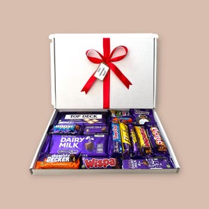 Large white gift box featuring an assortment of Cadbury chocolate bars, ribbon, and customizable message tag, perfect for weddings, corporate gifts, or large celebrations.