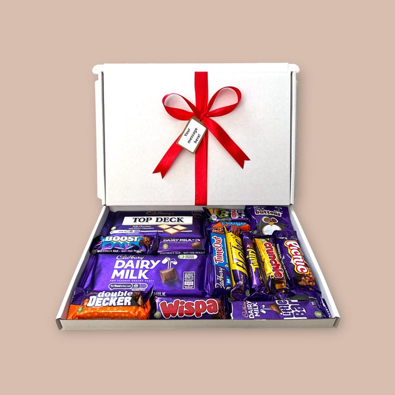 Large white gift box featuring an assortment of Cadbury chocolate bars, ribbon, and customizable message tag, perfect for weddings, corporate gifts, or large celebrations.