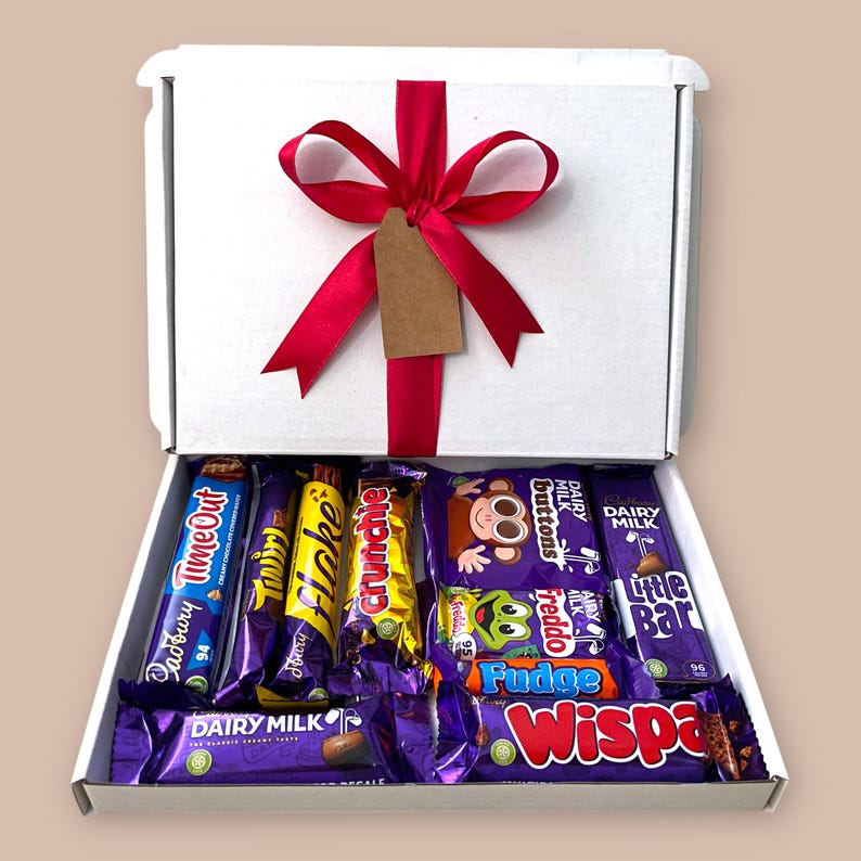 Medium white gift box filled with a selection of Cadbury chocolate bars, ribbon, and customizable message tag, ideal for anniversaries, holidays, and appreciation gifts.