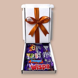 Small white gift box with assorted Cadbury chocolate bars, ribbon, and customizable message tag, perfect for birthdays, thank you gifts, and special celebrations.