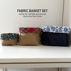 以下が含まれることがあります： つや消し仕上げの、斑点模様のセラミックマグカップ3個セット。マグカップはクリーム色、ライトグレー、ダークグレーの3色です。各マグカップはシンプルでミニマルなデザインで、丸みを帯びたハンドルが付いています。