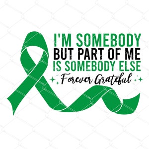 May include: Green ribbon with the text "I'm somebody but part of me is somebody else Forever Grateful" in black.