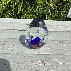 Art glass paperweight in unusual egg shaped design blue