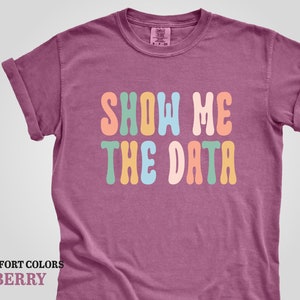 a t - shirt that says show me the data