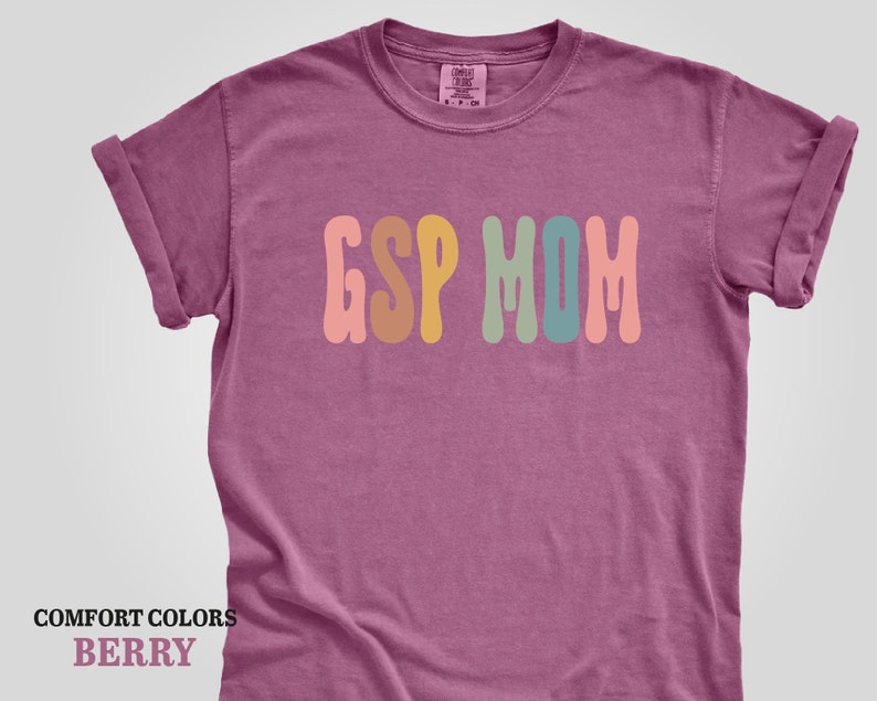 a t - shirt with the word's mom in multicolored letters