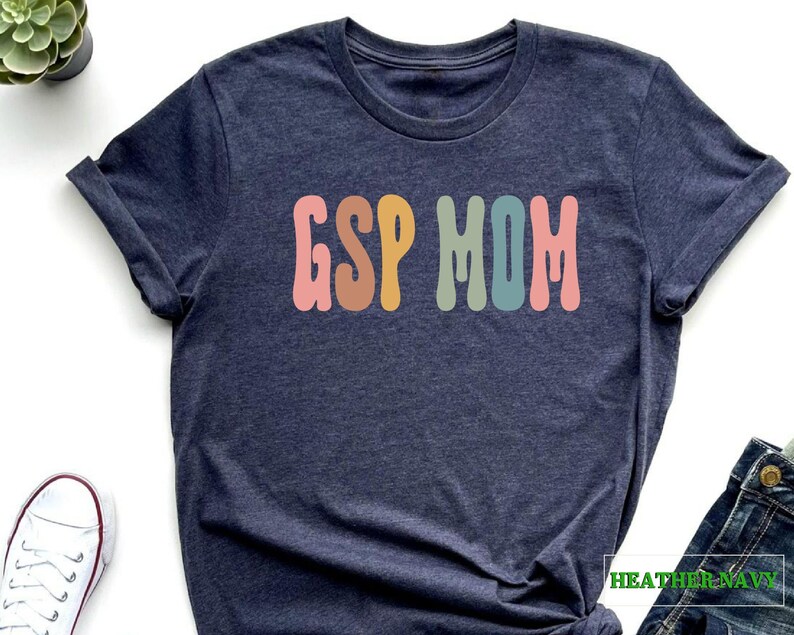 a t - shirt with the word g is for mom on it