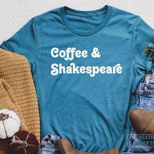 May include: A teal blue t-shirt with the text "Coffee & Shakespeare" in white retro-style lettering.
