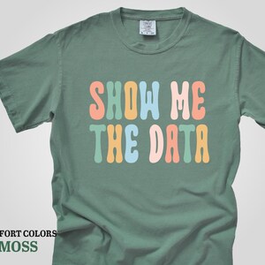 a t - shirt that says show me the data