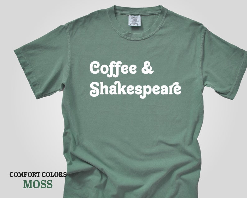 May include: A moss green t-shirt with the text "Coffee & Shakespeare" in white.