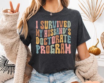 I Survived My Husband's Doctorate T-Shirt: Funny PHD Graduation Gift