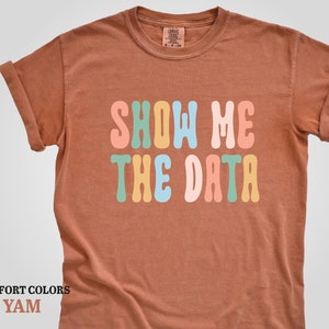 a t - shirt that says show me the data