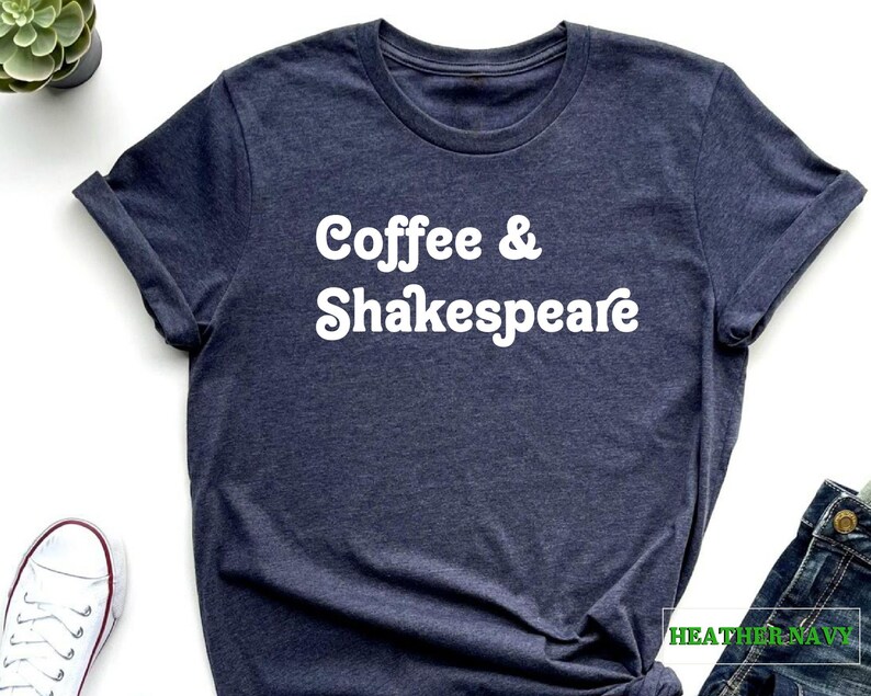 May include: A heather navy blue t-shirt with the text "Coffee & Shakespeare" in white.