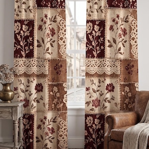 May include: A pair of floor-length curtains featuring a patchwork design of cream, brown, and deep red floral patterns interspersed with sections of intricate lace-like textures, all suspended from a dark brown metal curtain rod with finials.