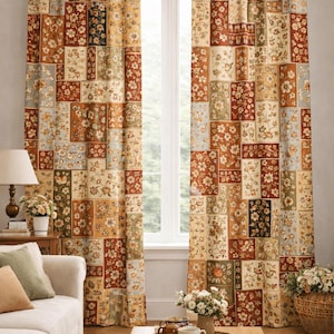 May include: Floral patchwork curtains in shades of brown, red, and beige. The curtains feature a repeating pattern of rectangular blocks with floral designs. The curtains hang from a dark brown rod, framing a window.