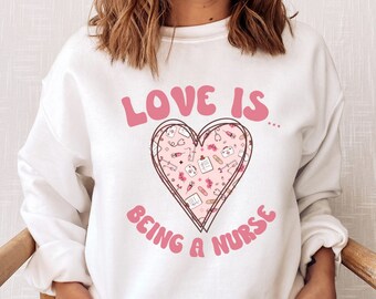 Love Is Being A Nurse Sweatshirt, Love Is Being A Nurse, Nurse Valentine Sweatshirt, Nurse Valentine Shirt, Nursing Sweater, New Nurse Gift