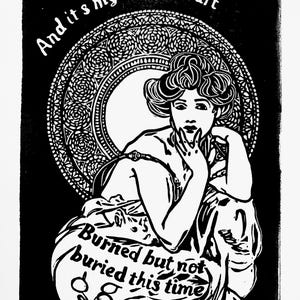 May include: Monochrome art print depicting a woman with a detailed hairstyle, framed by a decorative circular design. The text "And it's my whole heart" is above, with "Burned but not buried this time" below the figure.