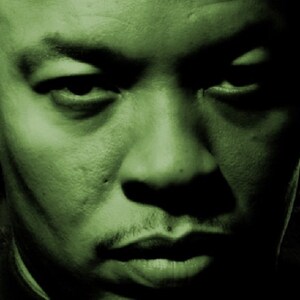 May include: A close-up portrait of a man with a serious expression. His face is green-toned, and he is looking directly at the camera. The background is a blurry image of a city skyline.