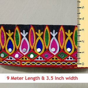 May include: Multicolored embroidered trim with mirrored accents on a black fabric base. The trim is 3.5 inches wide and 9 meters long.