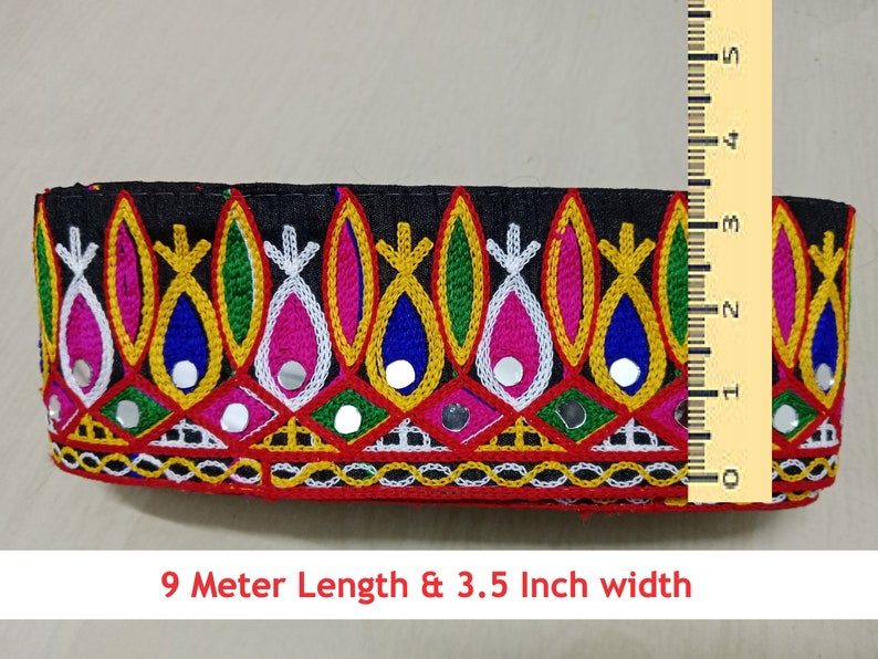 May include: Multicolored embroidered trim with mirrored accents on a black fabric base. The trim is 3.5 inches wide and 9 meters long.