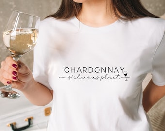 May include: White t-shirt with the text "CHARDONNAY s'il vous plaît" and a small wine glass graphic.