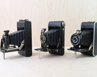 Collection of 3 vintage leather folding cameras - Kodak, AGFA, Coronet