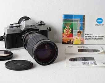 Vintage Minolta XG-1 35mm SLR film camera with Cosina Zoom lens 35-200mm 1:4-5.6