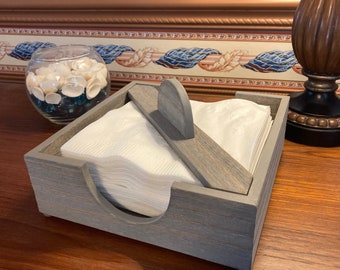 Solid Wood Napkin Holder with weighted lock in hold down rail. Available in 7 beautiful finishes. Custom work is our specialty.