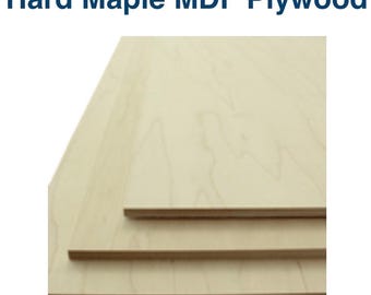 May include: Close-up of hard maple MDF plywood. The wood has a light, natural color with visible grain patterns. The image shows several stacked pieces of the plywood, highlighting the edges and the layered construction. The text "Hard Maple MDF Plywood" is at the top.
