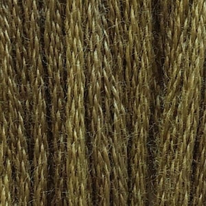 May include: Close-up of a skein of yarn in a dark green color. The yarn is called "Pine Needles".