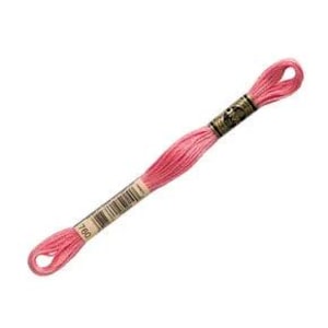 May include: A skein of pink embroidery floss, labeled with the number 760, is displayed against a white background. The floss is tightly wound and features a gold-colored paper band with the brand name and a barcode. The ends of the floss are looped.