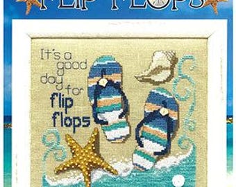 May include: Cross-stitch pattern with the words "Flip Flops" and a beach theme. The design includes two pairs of flip-flops, a starfish, and a seashell. The text "It's a good day for flip flops" is also included.