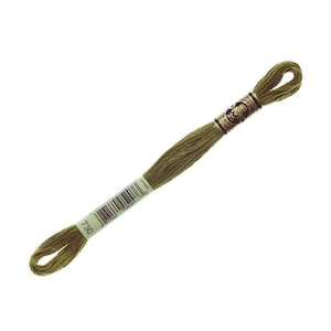May include: A skein of olive green embroidery thread, with a label showing the number 730 and a barcode. The thread is tightly wound and ready for use in needlework. The label also includes the brand name and other details.