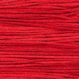 May include: Close-up of a bundle of bright red embroidery floss.