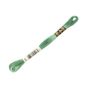 May include: A single skein of DMC brand embroidery floss in a light green color. The label indicates the color number is 320. The floss is tightly wound and ready for use in cross-stitch, embroidery, or other needlework projects.