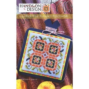 May include: Cross stitch pattern featuring a pumpkin patchwork design with orange, yellow, green, and blue colors. The pattern is titled "Pick Your Pumpkin Patchwork" and is from Hands On Design.