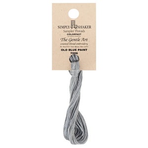 May include: A skein of Simply Shaker Old Blue Paint embroidery floss, color 7006, in a light blue shade. The floss is packaged on a brown card with the brand name and color information.