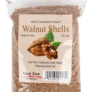 May include: A clear plastic bag filled with 12 ounces of ground walnut shells. The bag has a label that reads "100% Unscented Ground Walnut Shells", "Made in USA", and "For Pin Cushions And Other Dimensional Art". The label also includes the company name "Yarn Tree" and a barcode.