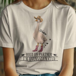 Stylish Hold On Partner Im Overstimulated shirt,funny goose cowboy tshirt,Western tee,Cowboy Duck Shirt Unhinged Tshirt,rodeo t-shirt,gift.