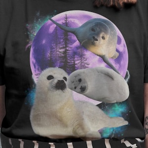 スタイリッシュなアザラシの動物シャツ、ヒップホップのブートレッグシャツ、レトロなビンテージ動物Tシャツ、ビンテージグラフィックTシャツ、月のTシャツ、海の動物のレトロシャツ。