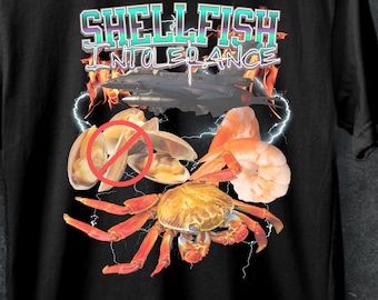 May include: Black t-shirt with a graphic design featuring a crab, shrimp, and clams. The text "SHELLFISH INTOLERANCE" is printed in a colorful font.
