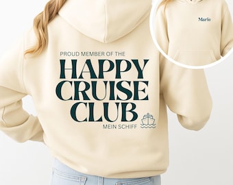May include: A cream-colored hooded sweatshirt featuring dark teal text on the back that reads PROUD MEMBER OF THE HAPPY CRUISE CLUB MEIN SCHIFF with a small cruise ship icon. The front chest area displays the name Marie in dark teal text.