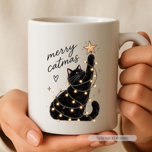 May include: A white ceramic mug featuring a black cat wrapped in glowing string lights, reaching up to place a gold star on top. The text merry catmas is printed in black script above the cat, accompanied by a small heart and star icons.