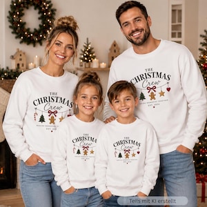 May include: Matching white crewneck sweatshirts for a family, each featuring the text 'THE CHRISTMAS CREW' in black, with a graphic of hanging ornaments including a candy cane, tree, gingerbread man, star, and heart, plus 'MAKING MEMORIES TOGETHER EST. 2026'.