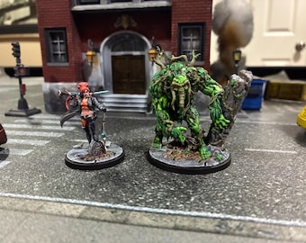 Pack de personajes de Elsa Bloodstone y Hombre Cosa pintados a mano de Marvel Crisis Protocol