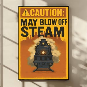 May include: A framed poster with a vintage train illustration. The poster has a yellow top with the text "CAUTION: MAY BLOW OFF STEAM" in black. The train is black with a bright headlight and steam coming from the smokestack. The background is orange.